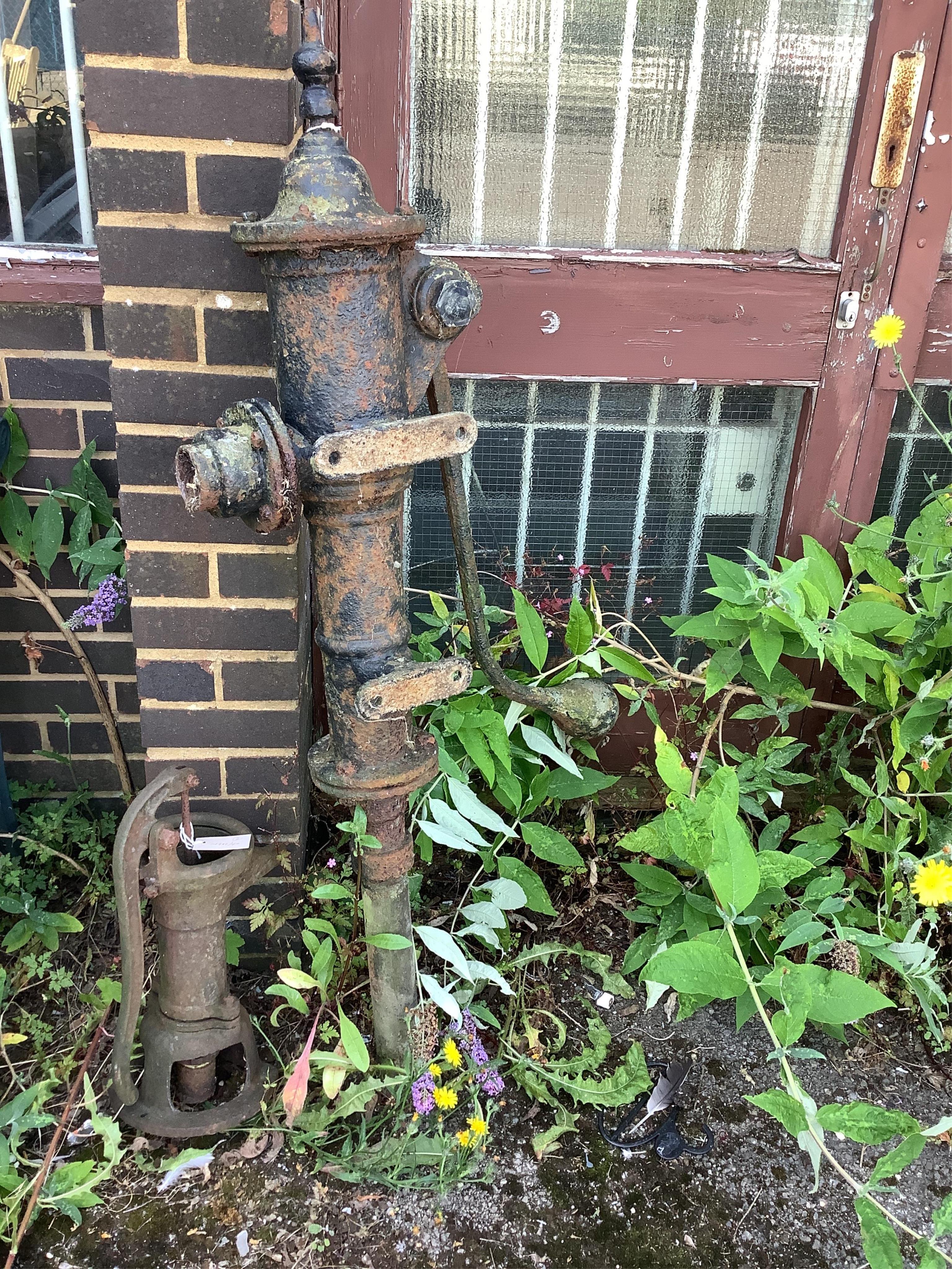 Two Victorian cast iron water pumps, larger height 130cm. Condition - fair